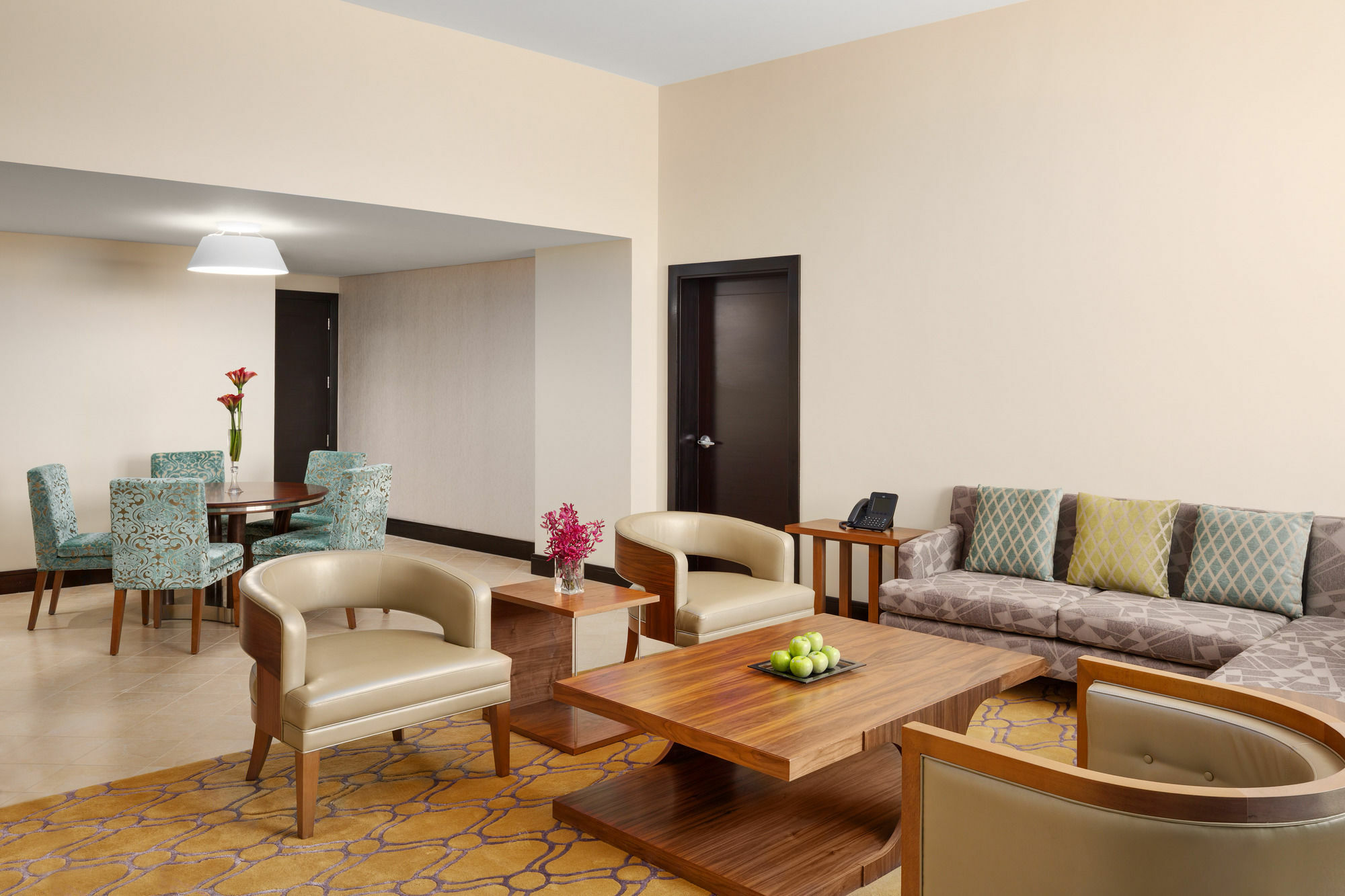 Millennium Hail Hotel Ngoại thất bức ảnh A living room in a suite at the hotel